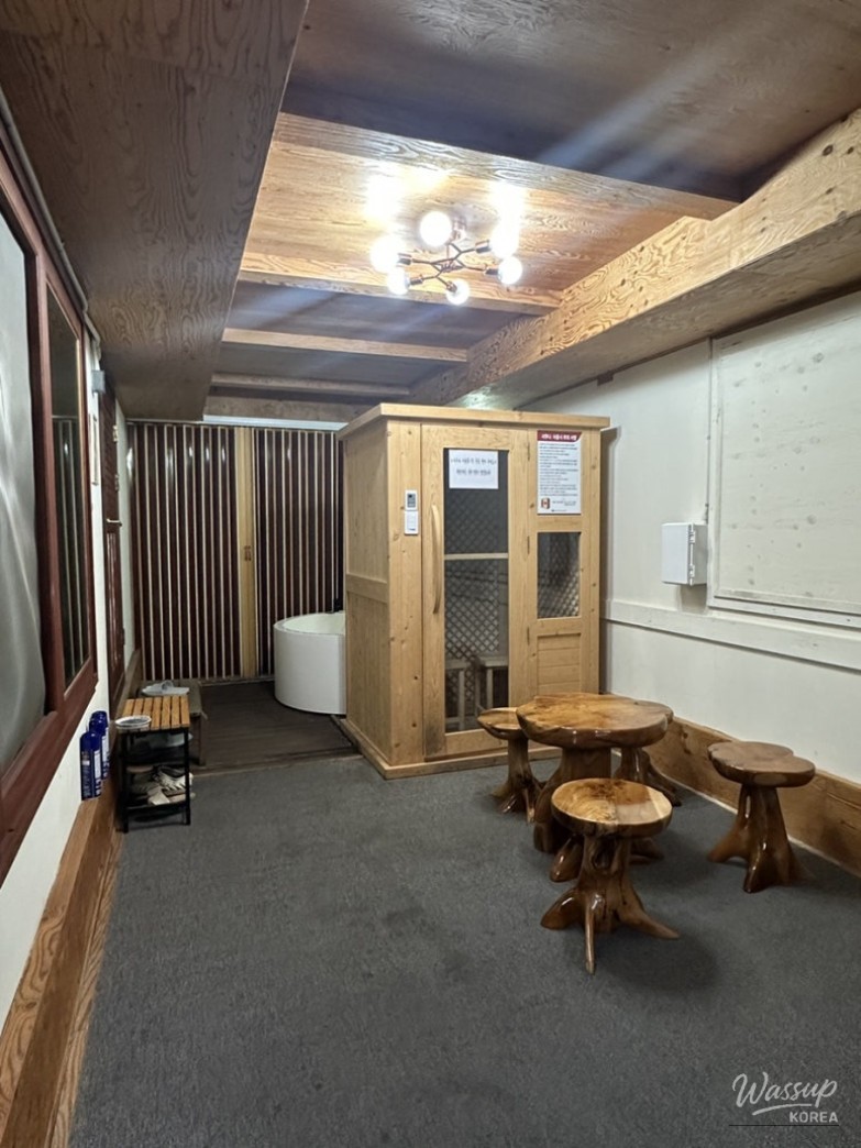 Modern loess jjimjilbang interior with clean resting areas and hinoki wood