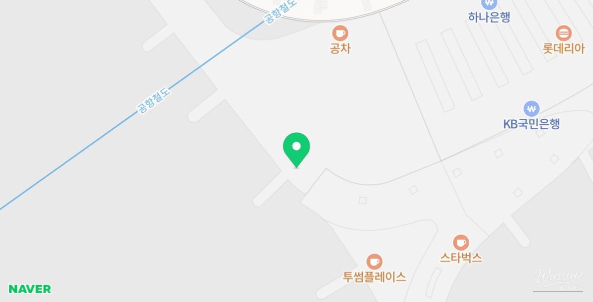 Clear signage guiding travelers to the duty-free pickup counter