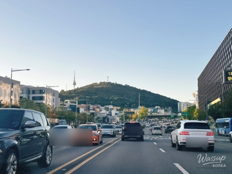 Happy times enjoying a meal with a view of the traditional Insadong streets from inside a restaurant