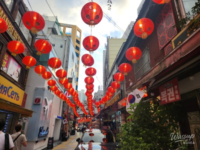 Detailed view of the multicultural market storefronts in the Chinatown district