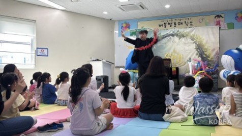 Joyful reactions of parents watching their children enjoy the magic