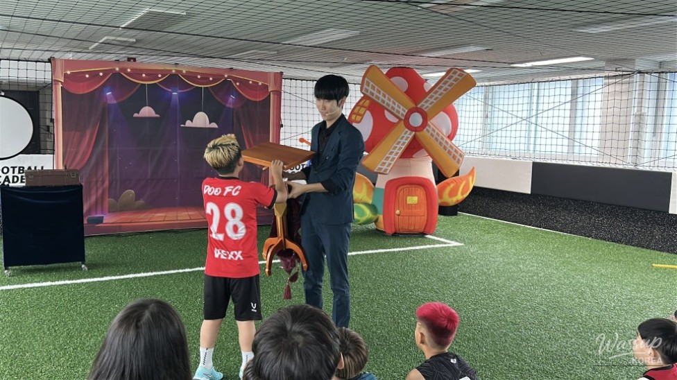 A professional magician performing a captivating magic show for a children's birthday party