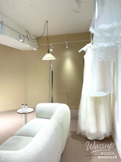 Detailed view of bridal accessories and dress embroidery