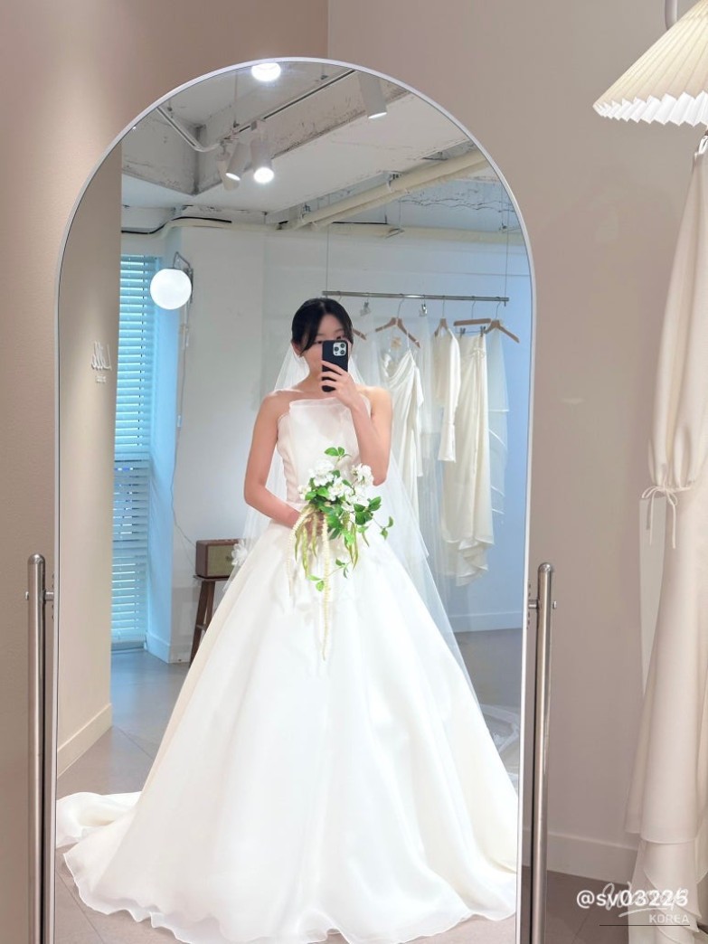 Elegant wedding dresses lined up in the boutique