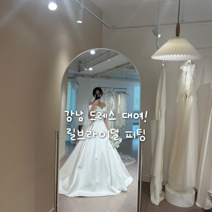 Exquisite silk wedding dress with a natural sheen displayed at Lil Bridal Gangnam