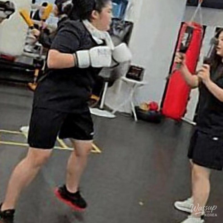 A happy moment shared between training partners at the gym