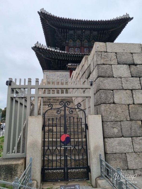 Rolling hills and city apartments blending together under the autumn sun