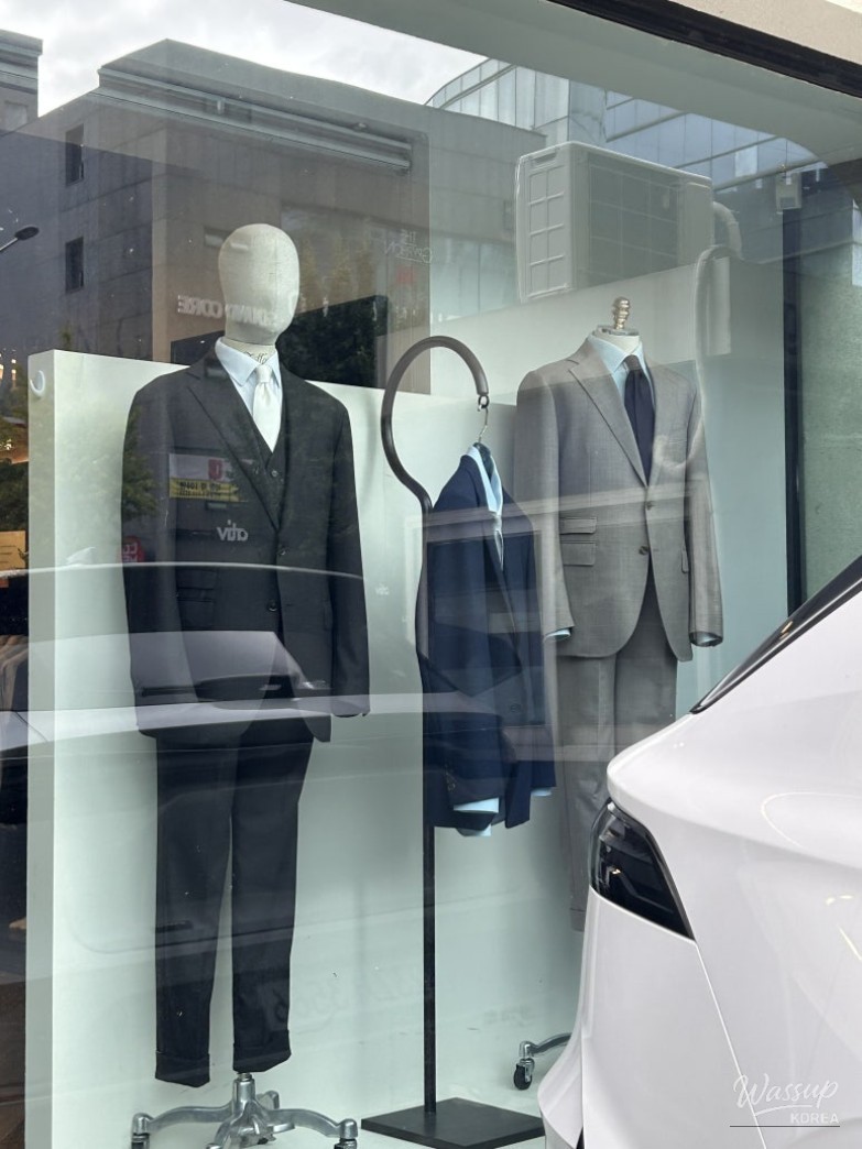 A collection of high-quality fabrics and samples available at the tailoring shop