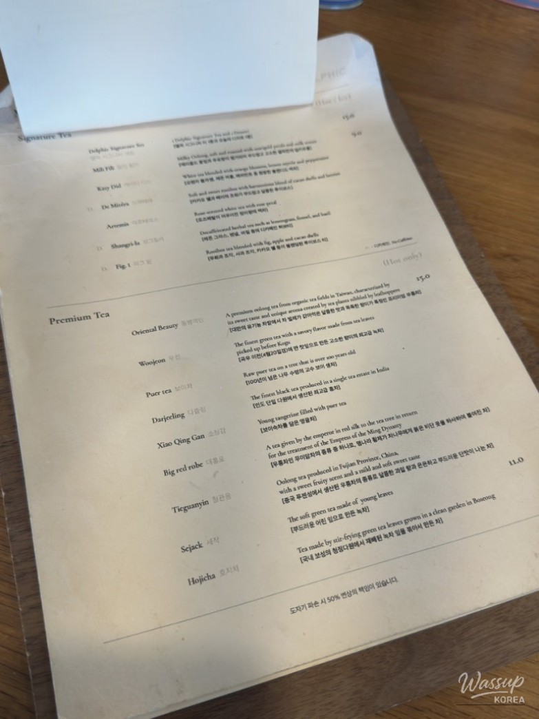 Signature Matcha Ice and sable cookies served at the elegant Delfic Anguk Flagship Store