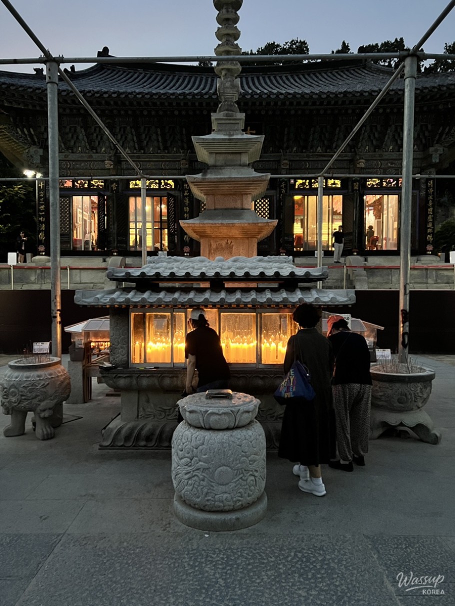 The tranquil interior of Daeungjeon Main Buddha Hall where visitors participate in services