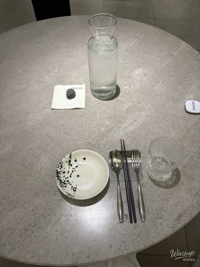 Rosé Budae Jjigae pasta being served in a stylish bowl