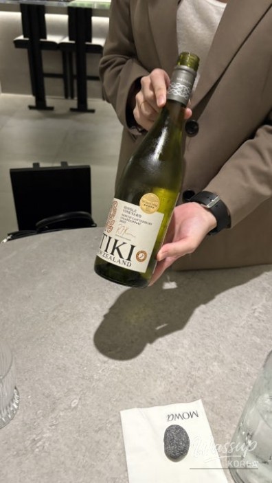 Professional kitchen staff preparing contemporary Korean fusion dishes