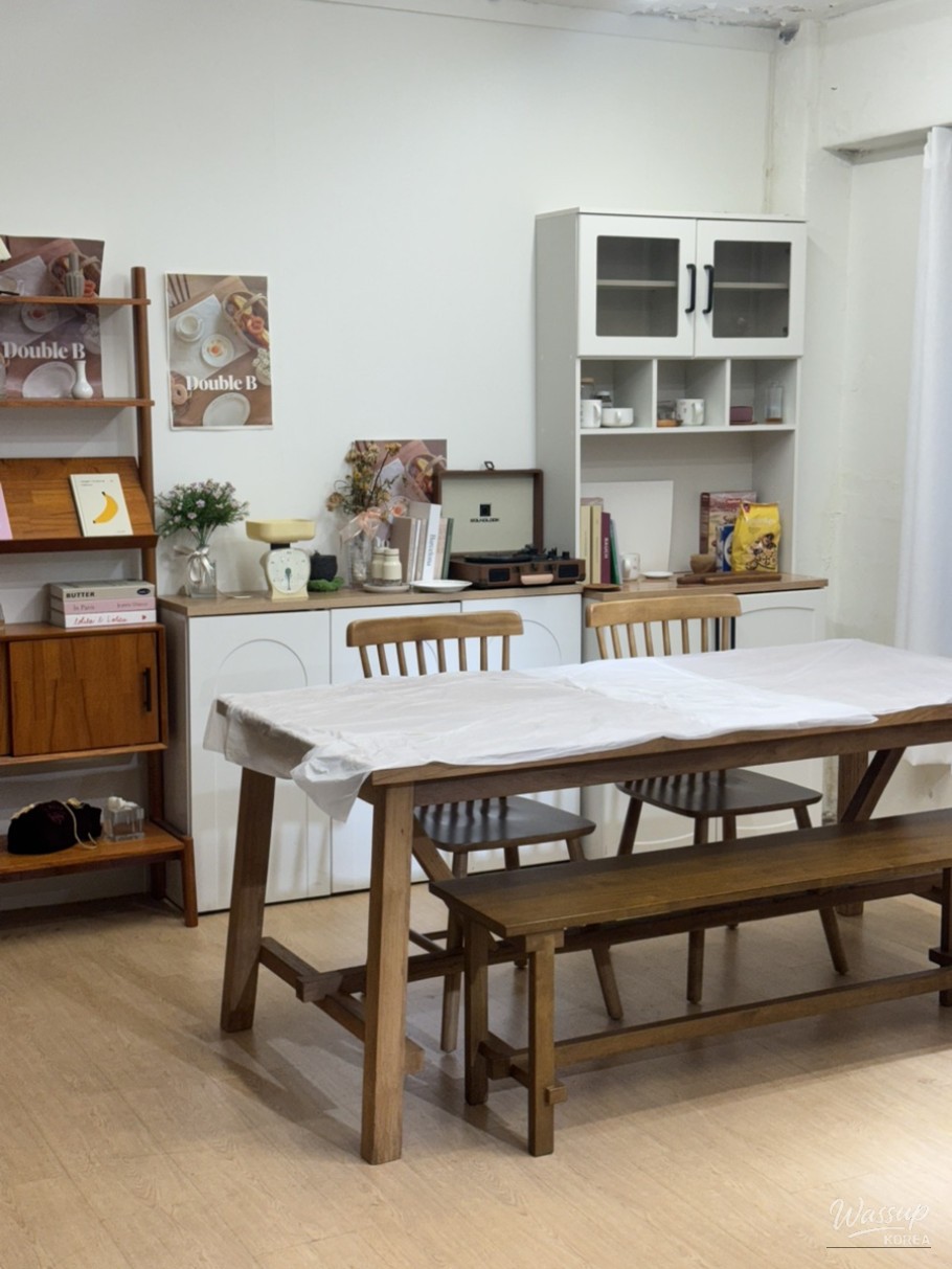 Clean and cozy wood-tone interior of Double B Studio Hyehwa party room