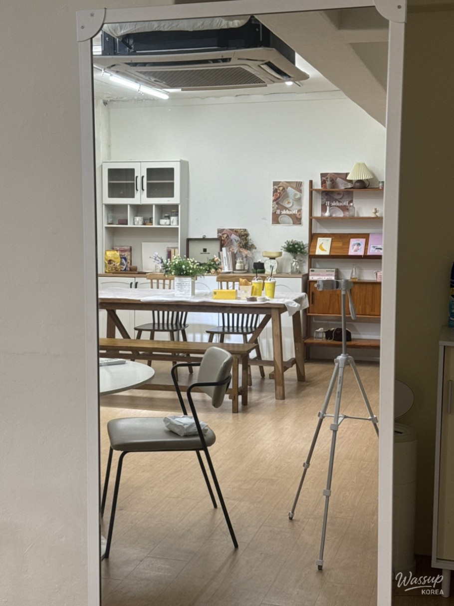 Comfortable seating area with wood-tone tables and cozy lighting