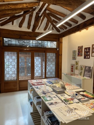 Close-up of cute independent publications displayed on wooden shelves