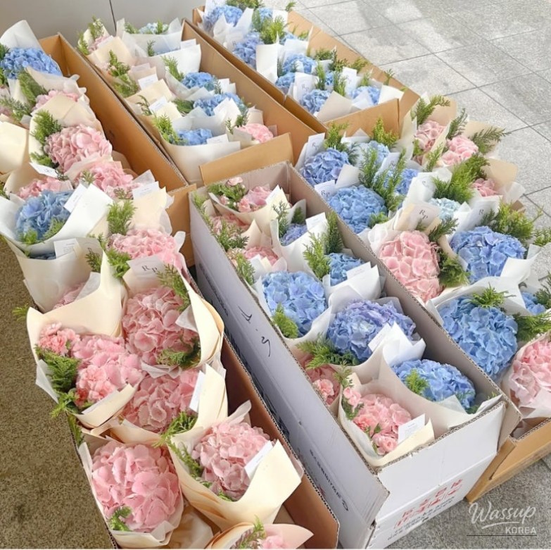 A collection of elegant and professional corsages prepared for a corporate event