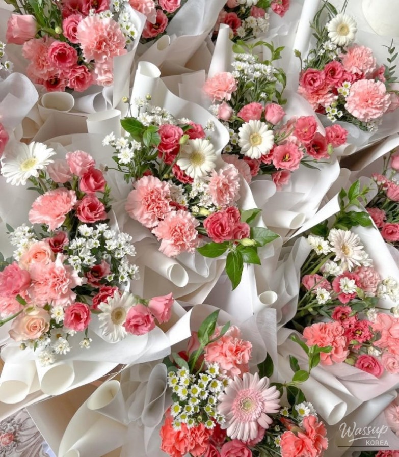 Signature pink corporate bouquets lined up for delivery to COEX and Magok