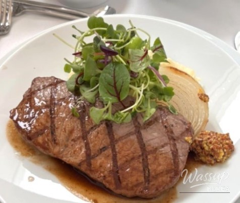 Spectacular presentation of the sirloin steak main course at the wedding banquet