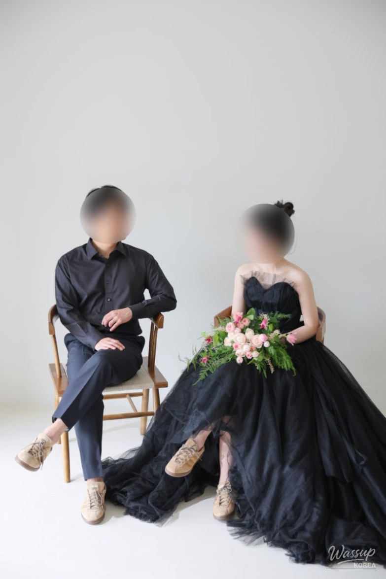 Mysterious and artistic lighting used for a close-up of the wedding rings and veil