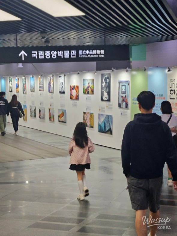 Touching scene of a father and daughter holding hands in the museum lobby