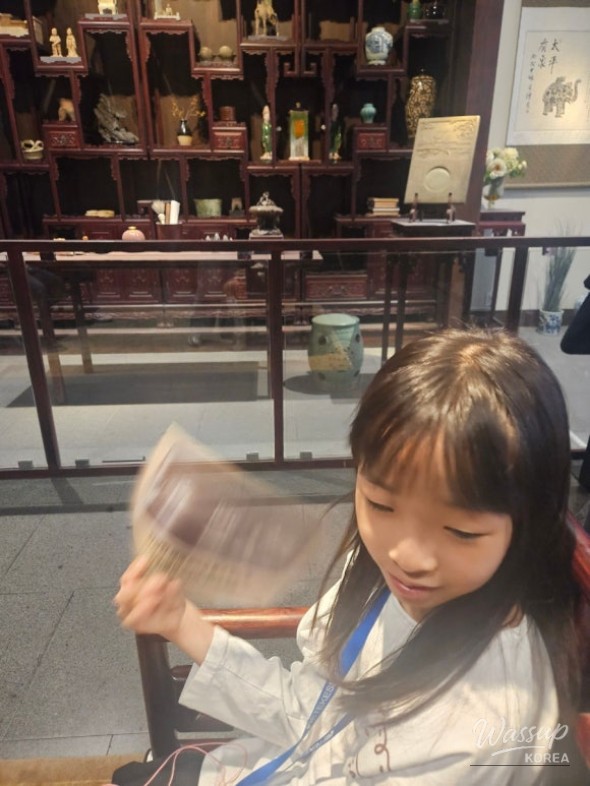 Special moment standing under the grand entrance arch of the museum