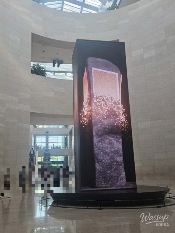 Dreamlike moment standing before a floor-to-ceiling digital art piece