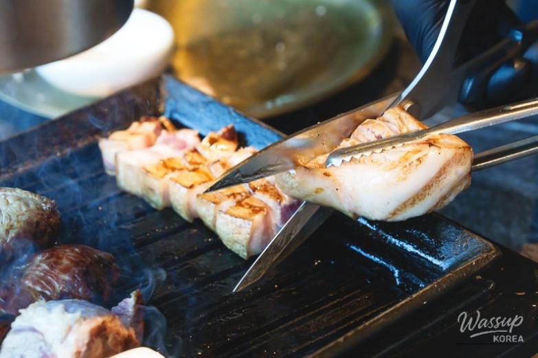 Golden colored pre-cooked meat in the smoking area