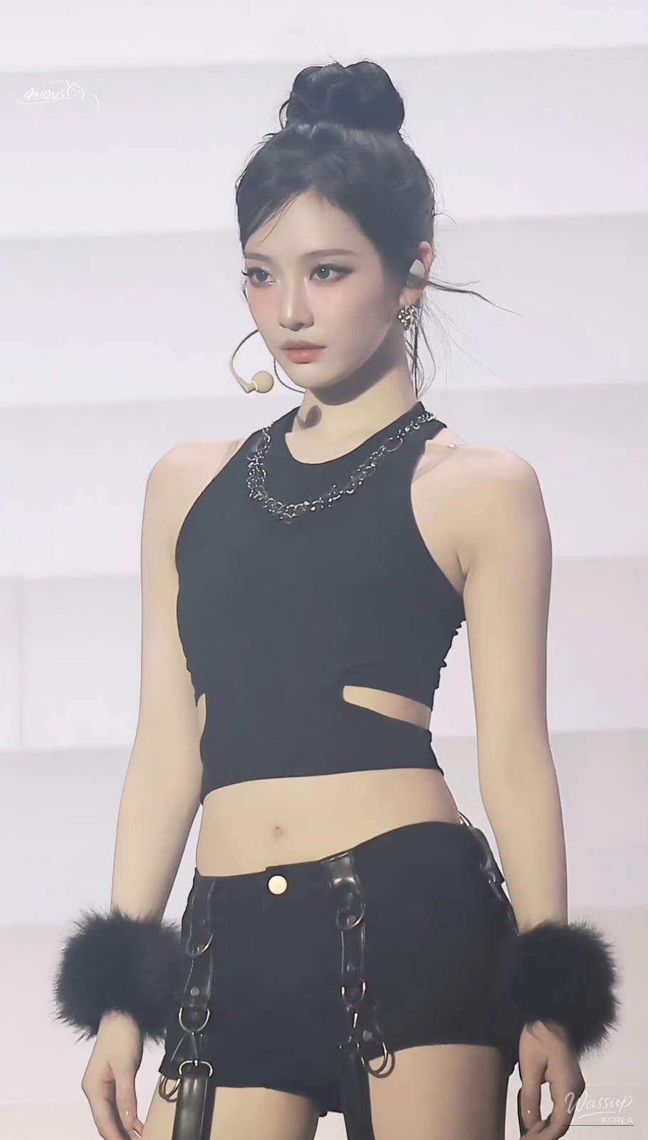 Glossy toned-down lip makeup balancing the weight of black outfits