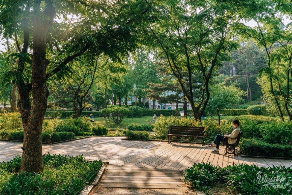 Artistic garden installation featuring colorful flowers and modern sculptures