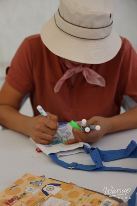 Smiling visitors taking photos at a themed photo zone