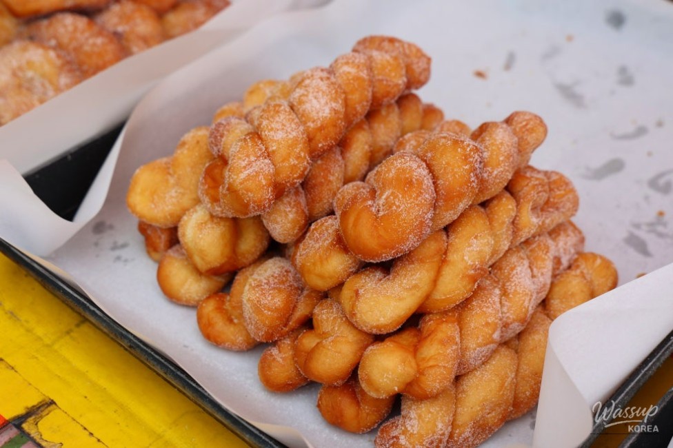 Willow trees reflecting in the calm waters of the lake