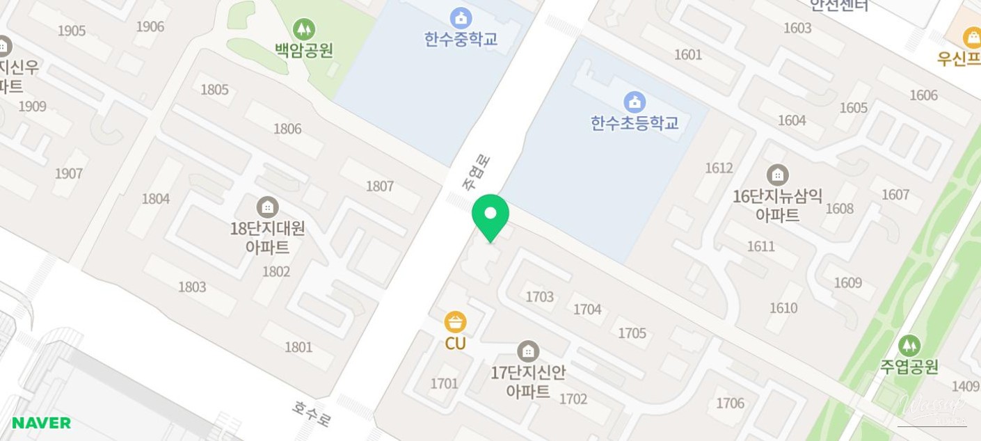 Interior reading area with low bookshelves and warm lighting for children