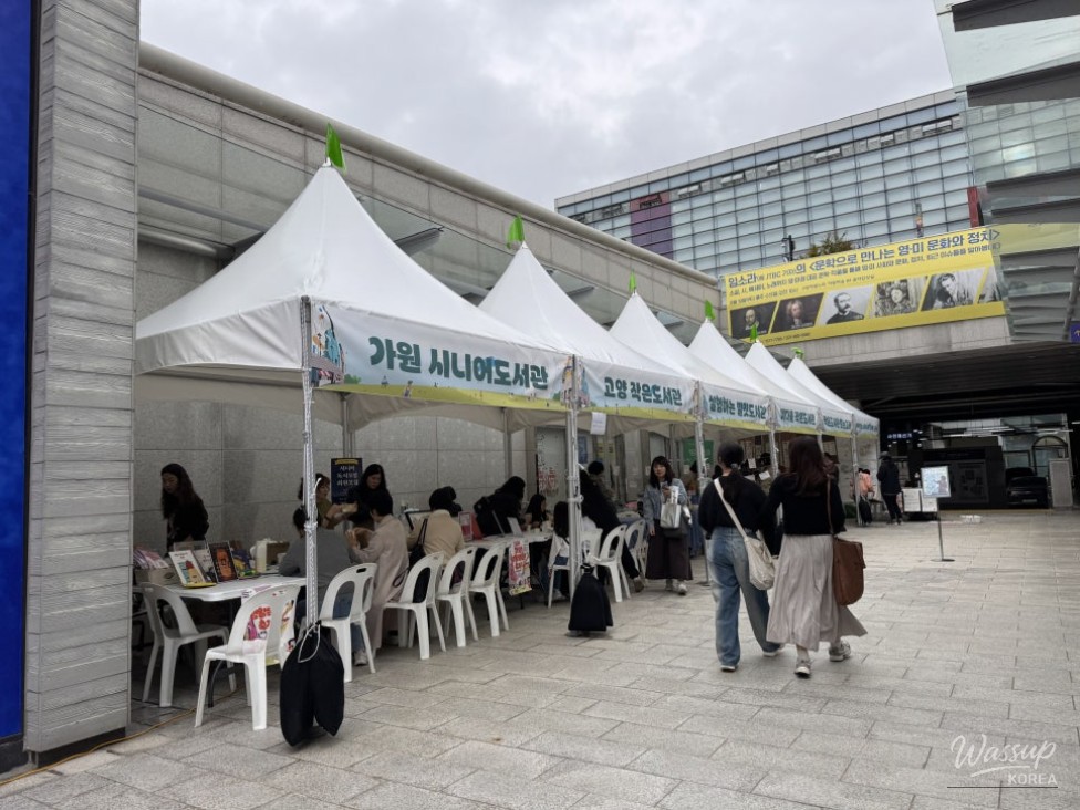 An interesting image of children creating clay magnets at a free experience booth
