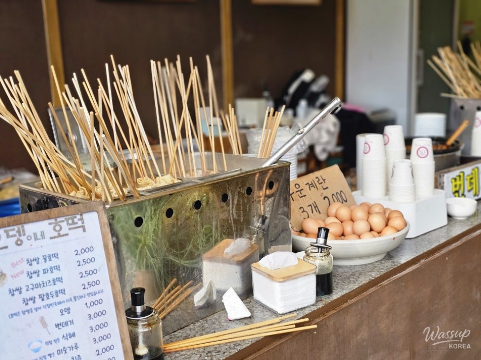 The Macheondae summit marker on Daedunsan Mountain overlooking the autumn landscape