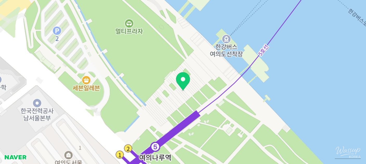 Trail runners navigating a steep and rocky mountain ridge overlooking Seoul