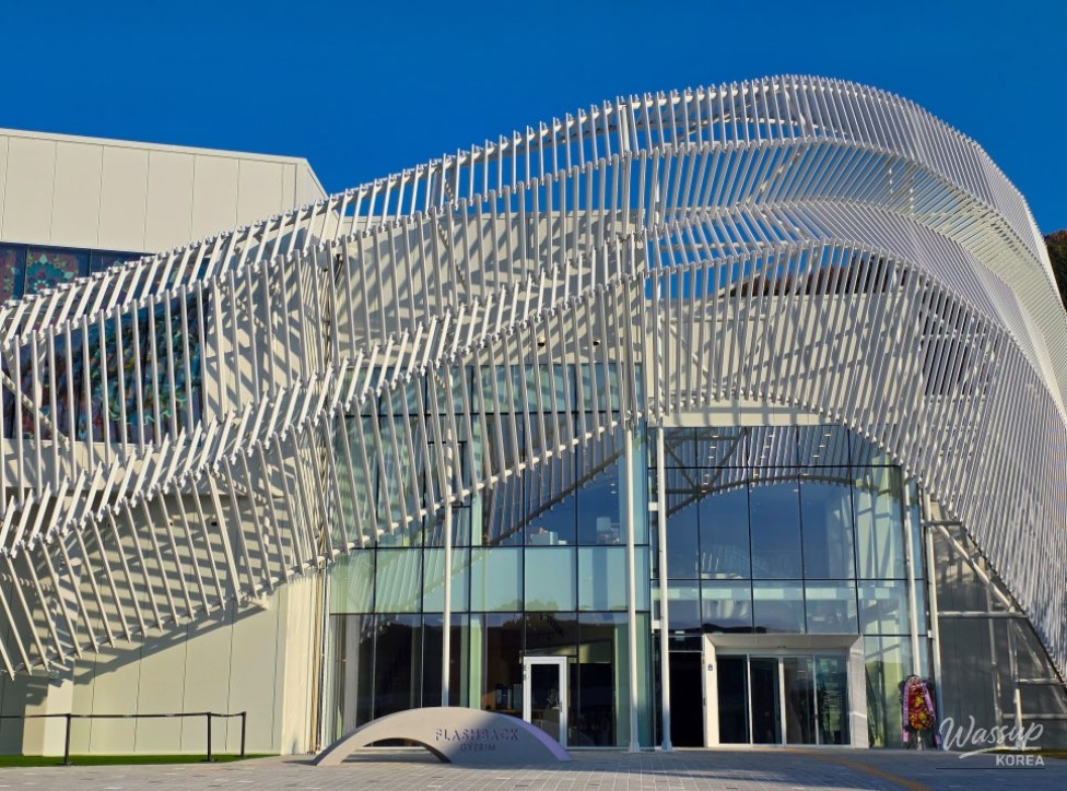 Stained glass gallery filled with colorful light at the end of the Gyelim Flashback exhibition