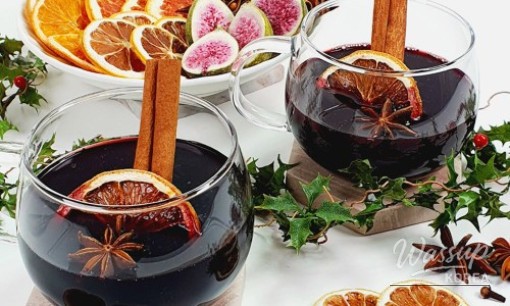 A completed bottle of homemade mulled wine, beautifully packaged as a gift