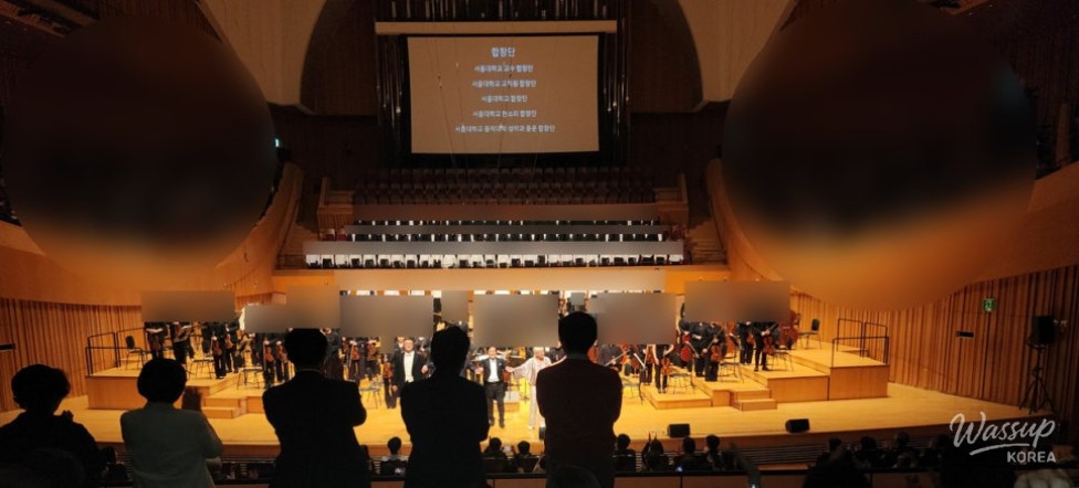 Orchestra and choir preparing on stage during the SNU Symphony Orchestra concert