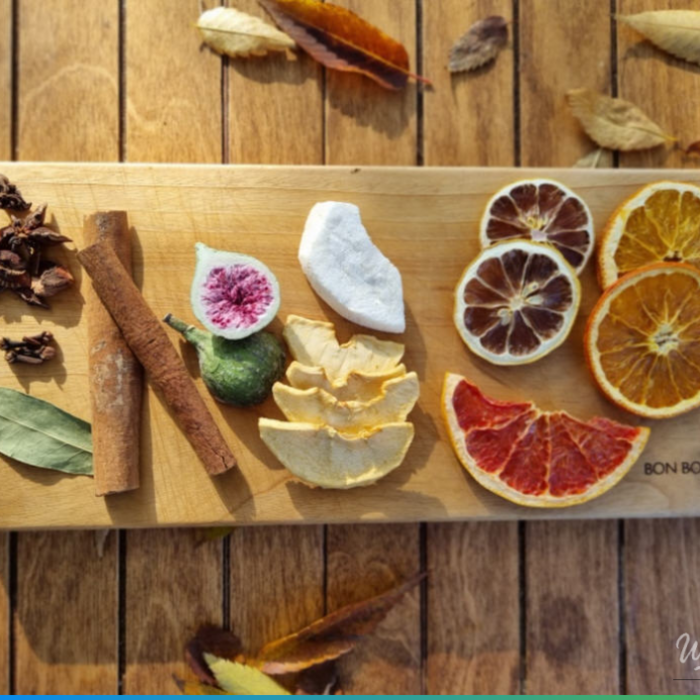 A beautifully prepared mulled wine making kit with various spices and fruits