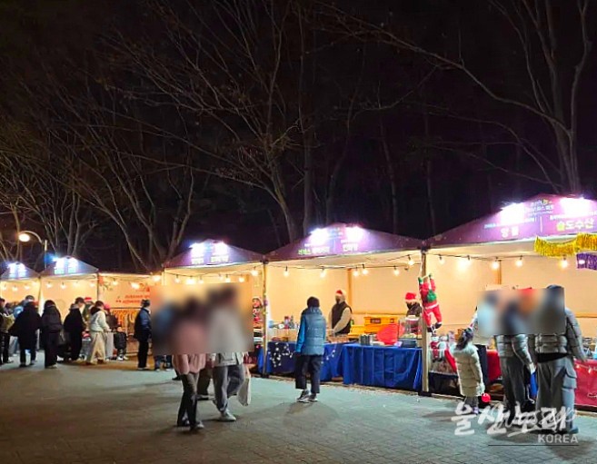 Christmas tree and photo zone featuring Santa and festive decorations