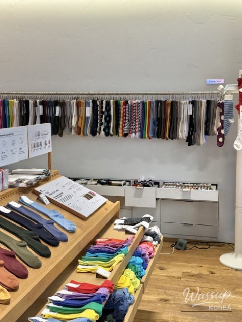 Modern display shelves showcasing socks at 1507 Benefit Lounge