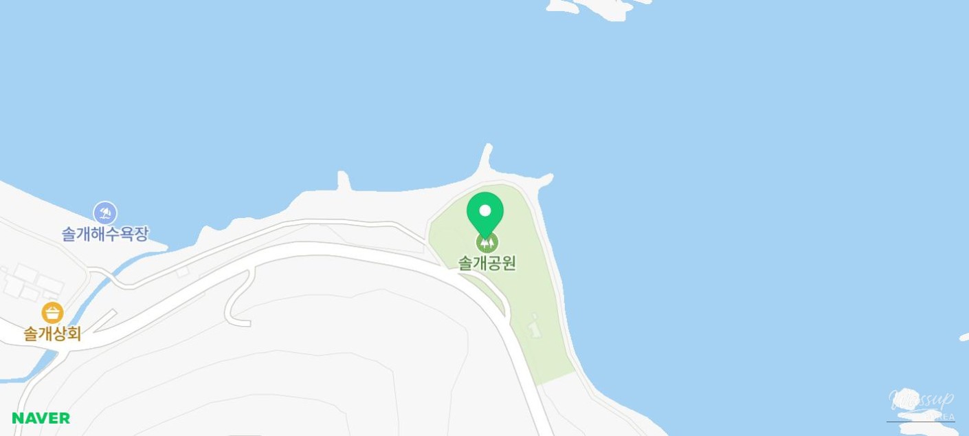 Walking trail surrounded by trees and open sea views at Solgae Park