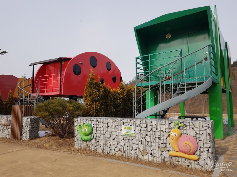 Riverside camping scenery at Yecheon Samgangnaru Campground surrounded by mountains