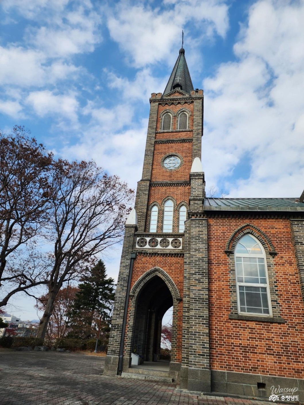 Red brick walls of Gongju Jungdong Cathedral resembling a European church setting