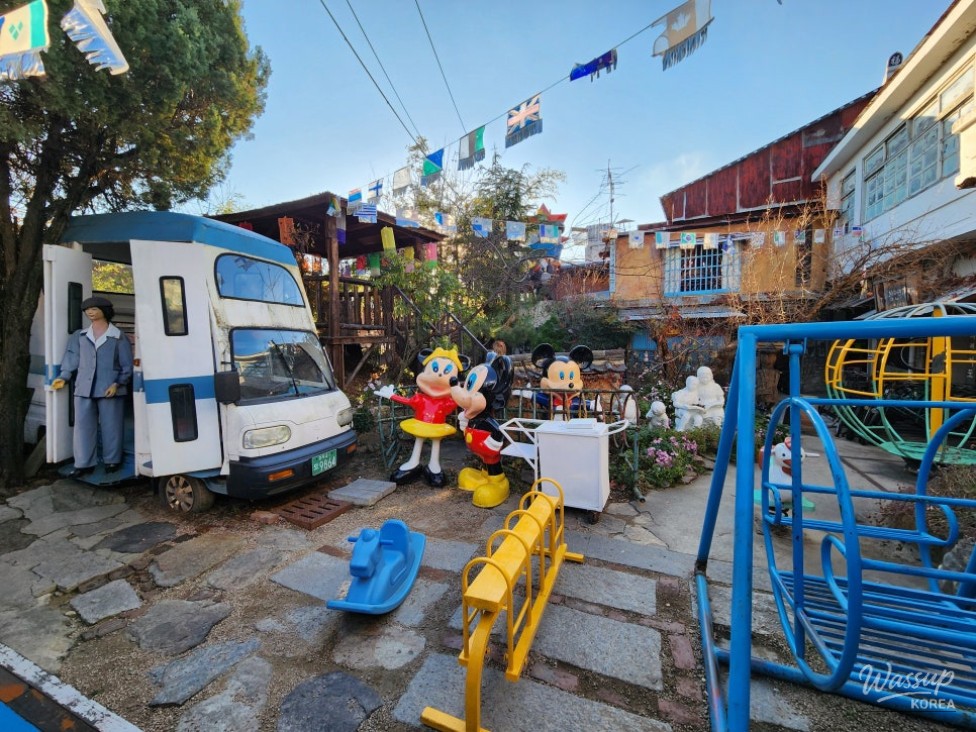 Narrow and winding museum pathways filled with historical displays