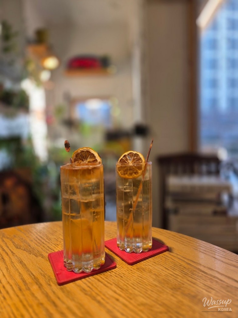 Potion cafe interior snapshot showing warm 분위기 and decor