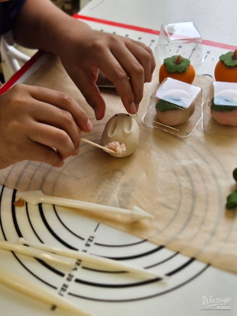 Different wagashi designs made by children using the same materials