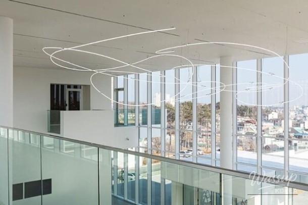 Natural light entering the exhibition halls through large glass windows