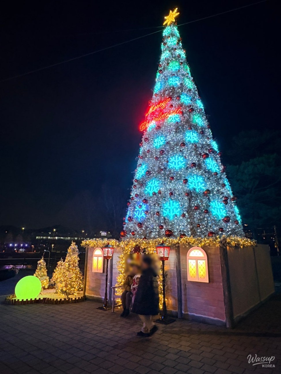 Santa and snowman decorations forming a cozy mini Christmas village