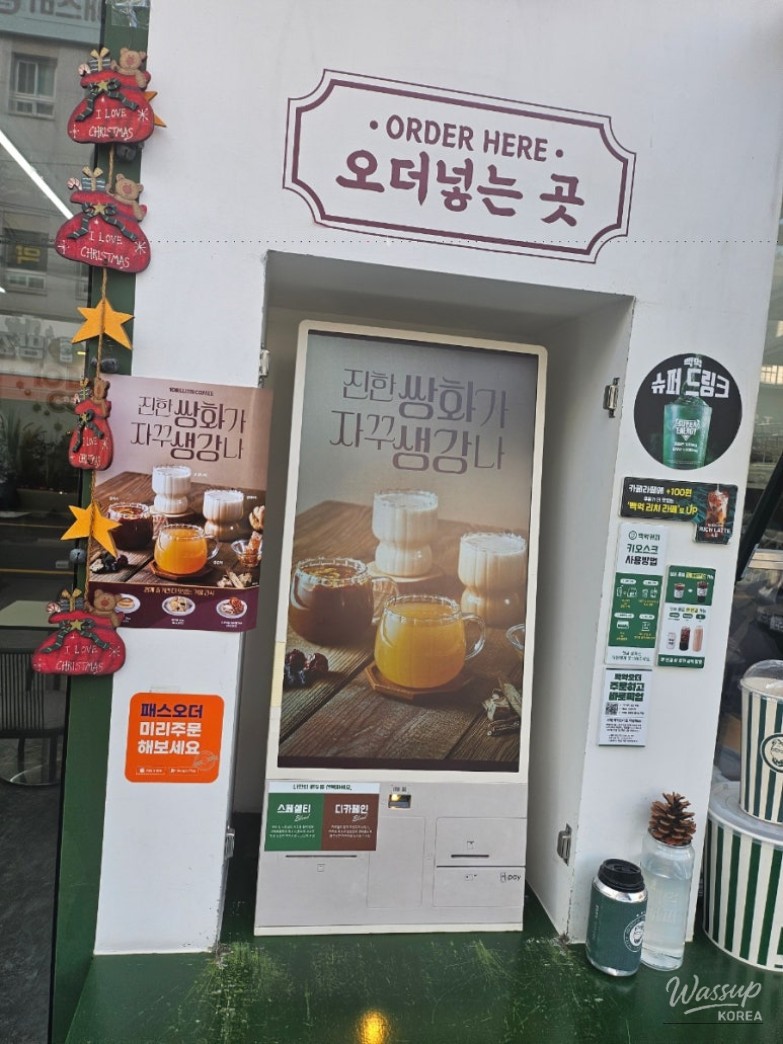Cafe table filled with croque monsieur, tteokbokki, and coffee